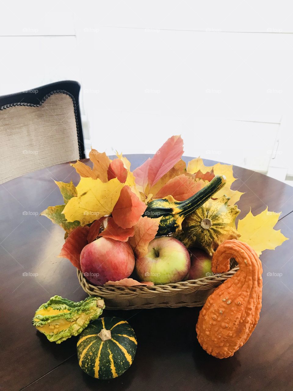 Happy fall! A composition with bright colorful autumn leaves, pumpkins and apples