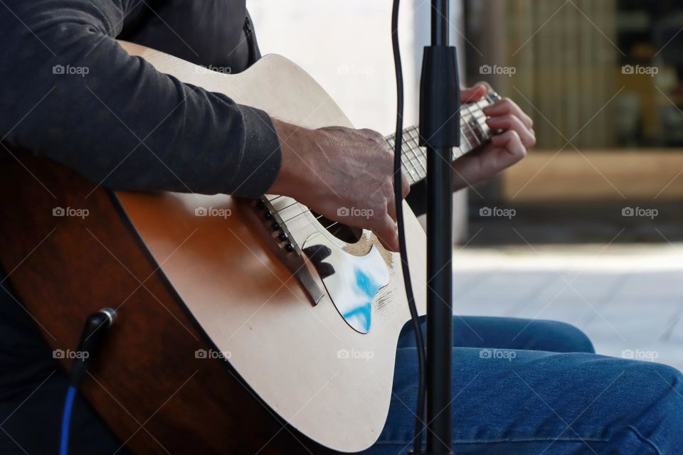 Playing guitar on a street