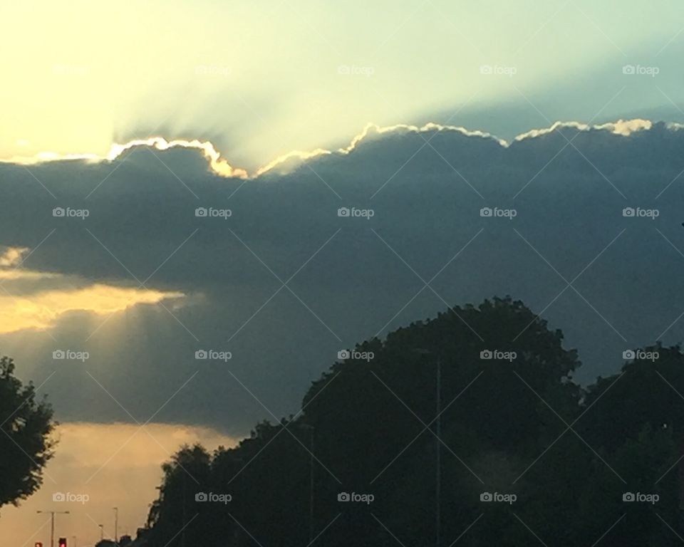 Breath taking . The sun always finds a way to show its face behind the clouds to cheer up a miserable day. 