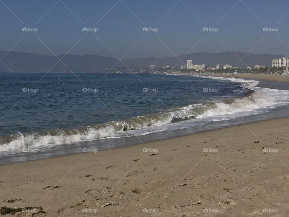 Pacific Ocean shore in Venice Beach. Coastal view to the North.
