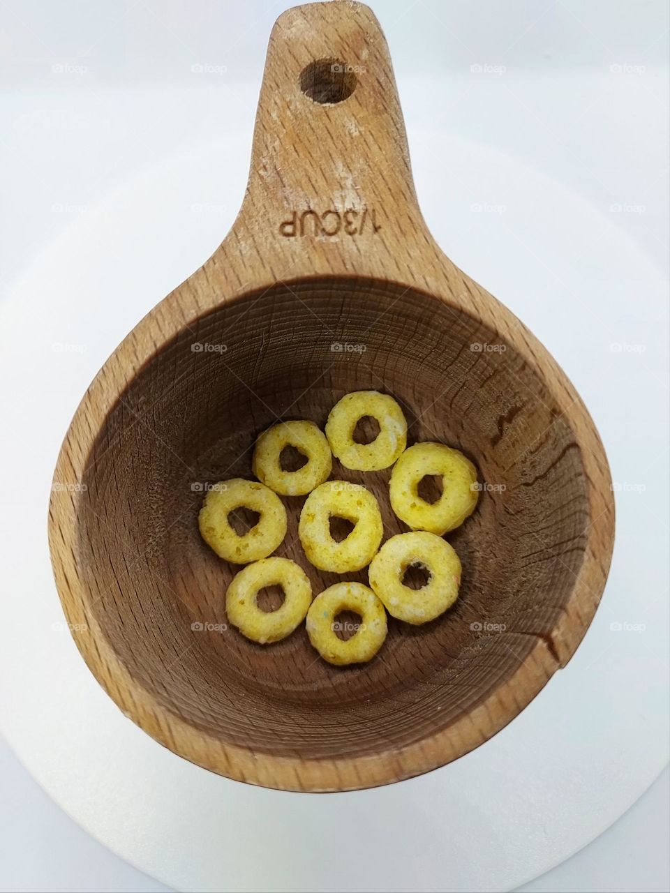 Circles of lemon flavor fruity goodness in a circle measuring cup.