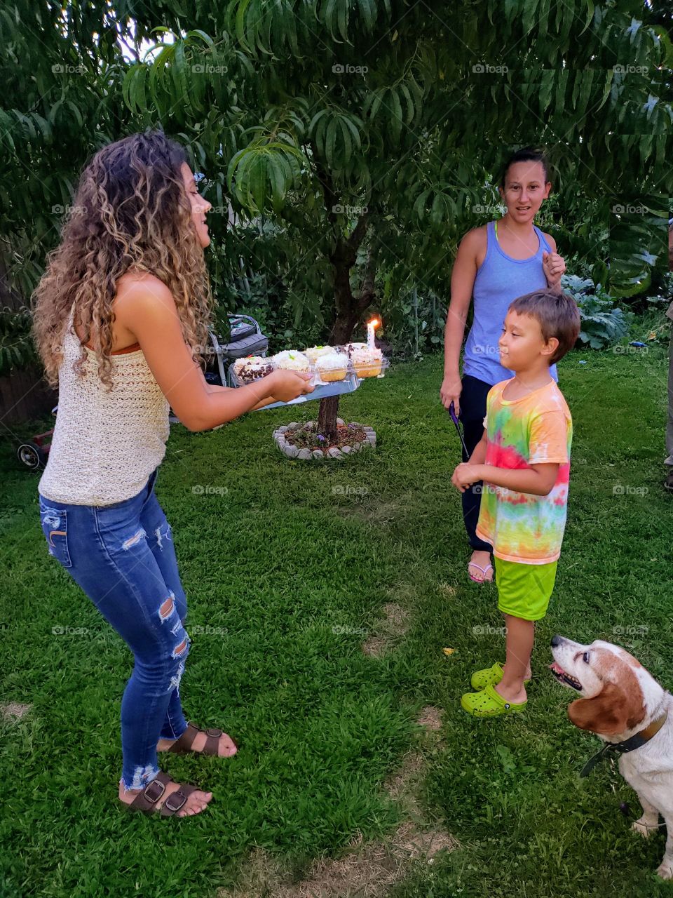 Little Boy Blowing out the Candles on His Birthday Cake