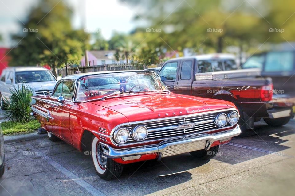 Chevrolet. A cherry red Chevrolet 