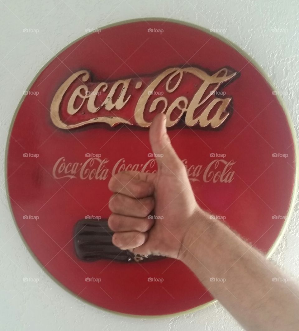 Thumbs up for Coka a Cola