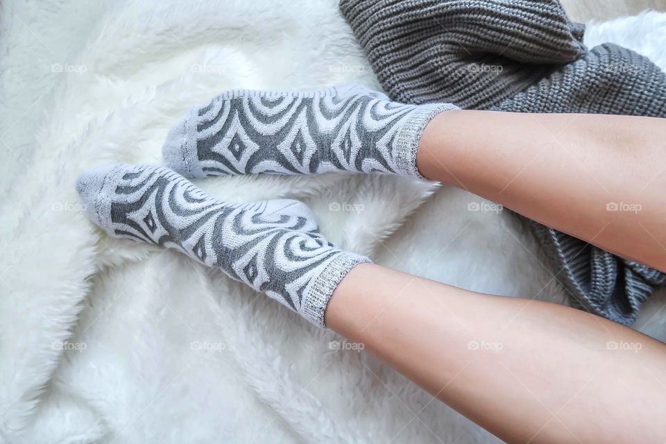 Woman's legs in warm socks 