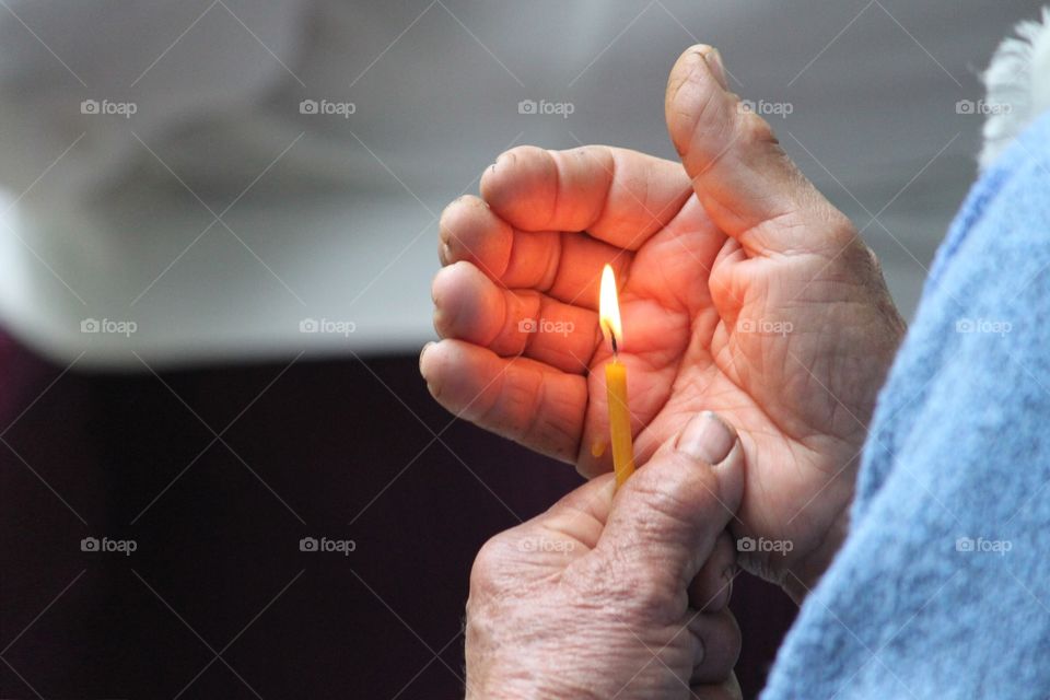 Grandma holds candle 