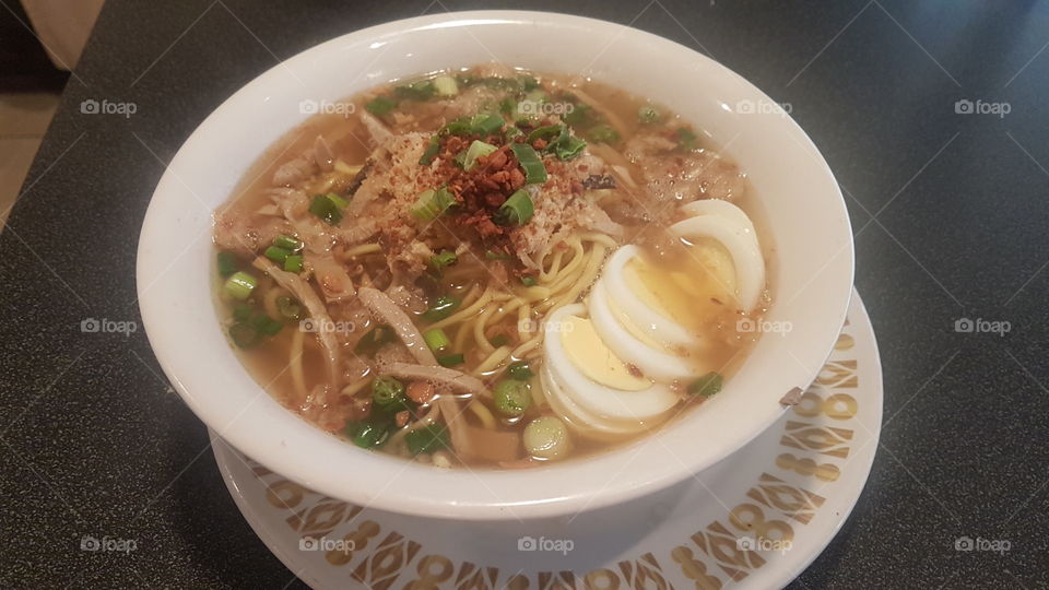La Paz Batchoy. A Filipino noodle dish from Ilo-ilo. Made with a deep pork broth and topped with noodles, pork belly, crispy chicharon, liver and hard boiled eggs.