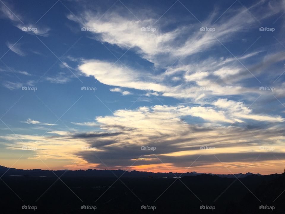 A Cloud Streaked Sky. A stunning view of a Tucson sunset from Gate's Pass