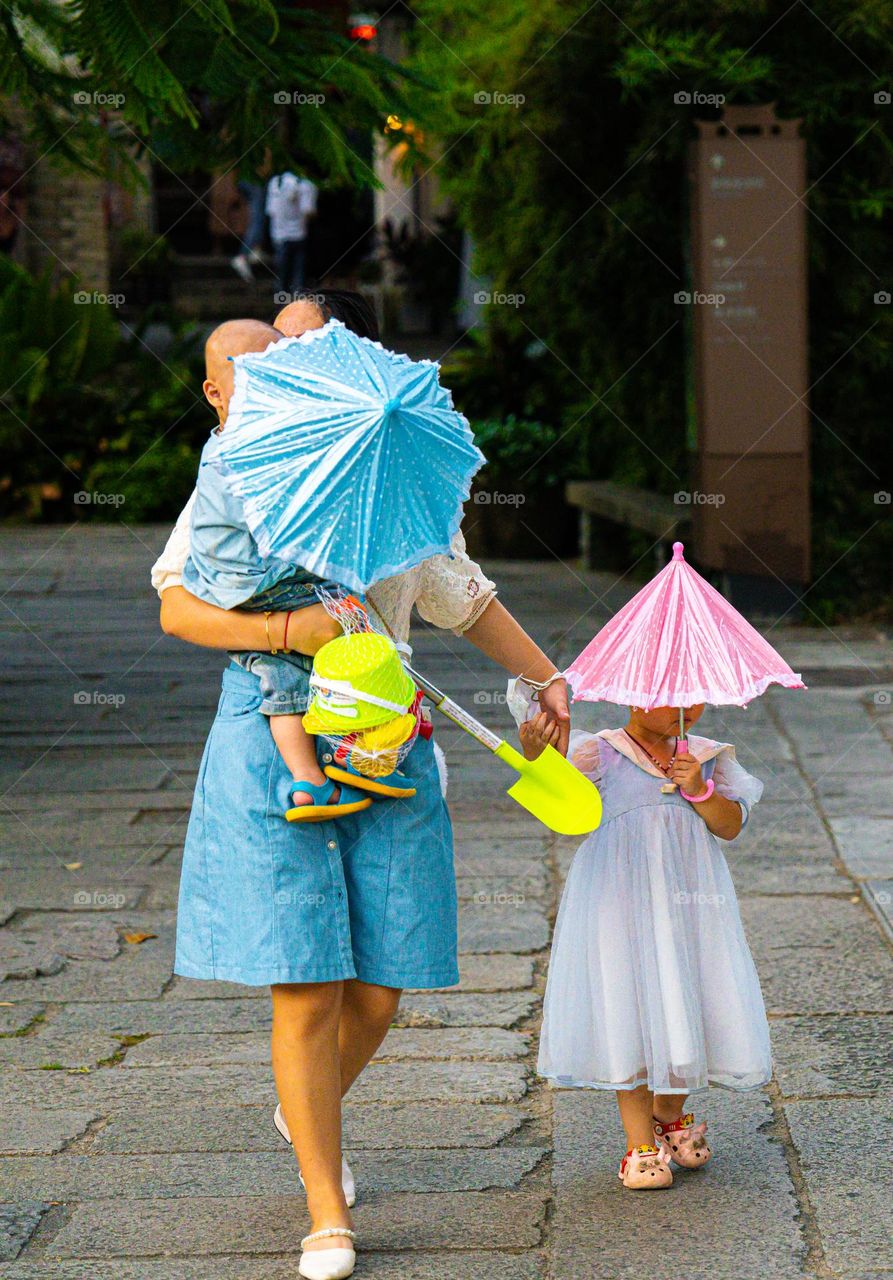 A mm is a great blessing from God. This photo shows the efforts and care of a mom for her babies .In strong sun mom is protecting her babies is appreciable.This photo is dedicated to all moms In the world.