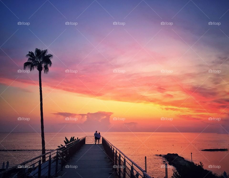 An amazing sunset by the sea. The colors painted the sky with beauty! A moment where time stops and silence is so loud.