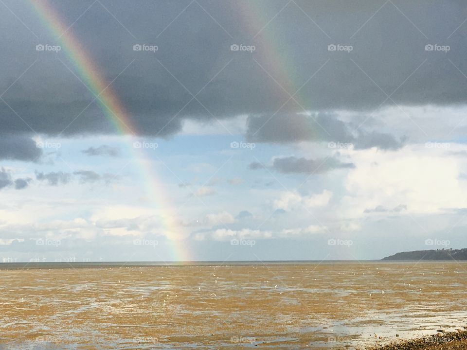 Double rainbow seen across Minster-on-Sea Beach in Kent. A pretty shot. Rainbows always make me feel lucky. 