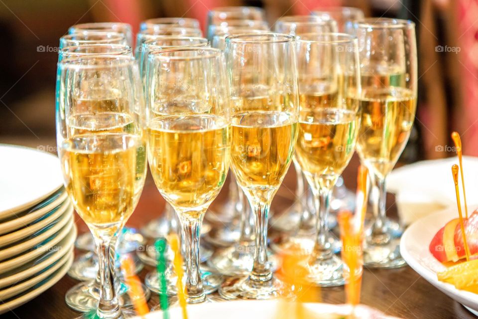 rows of champagne glasses on the table