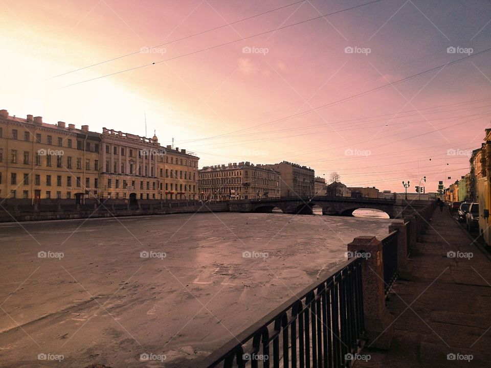 Cityscape in sunlight. Narrow river in the city. Saint Petersburg, Russia