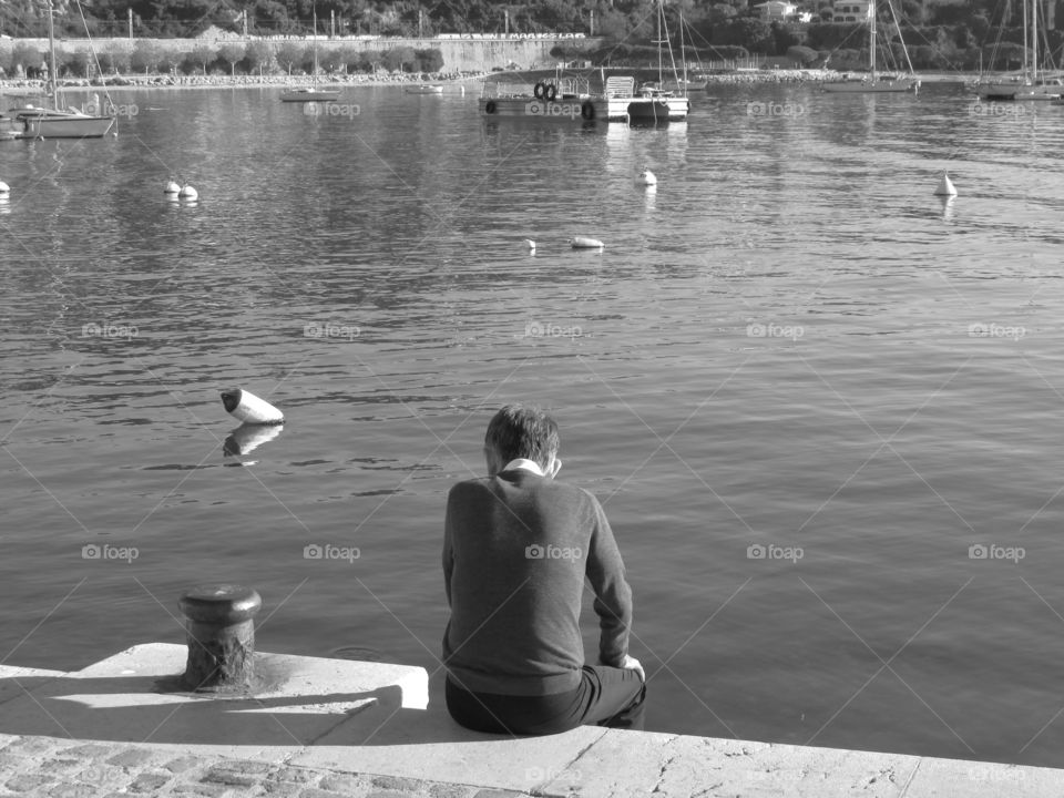 Person resting near river
