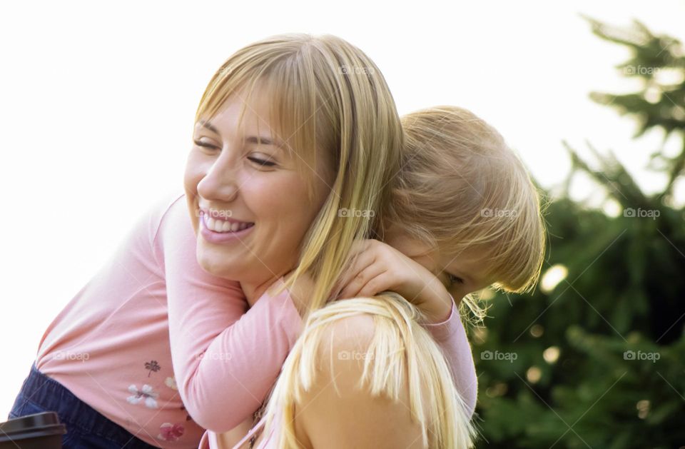 Mom hugging her daughter