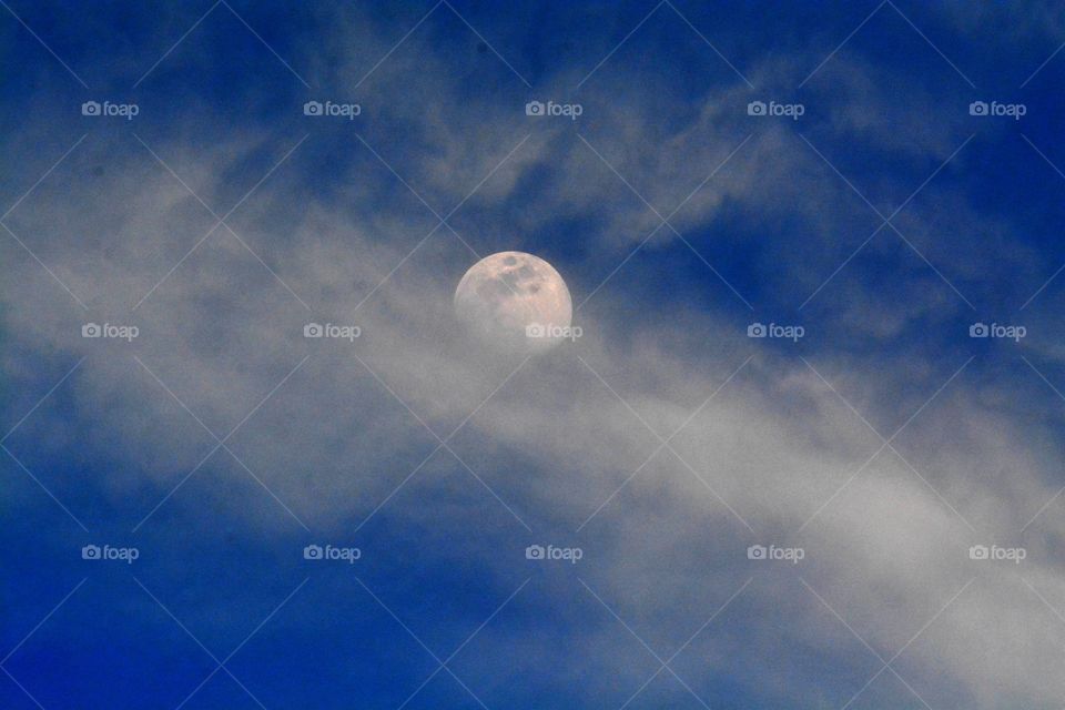 Enchanting moon between the clouds