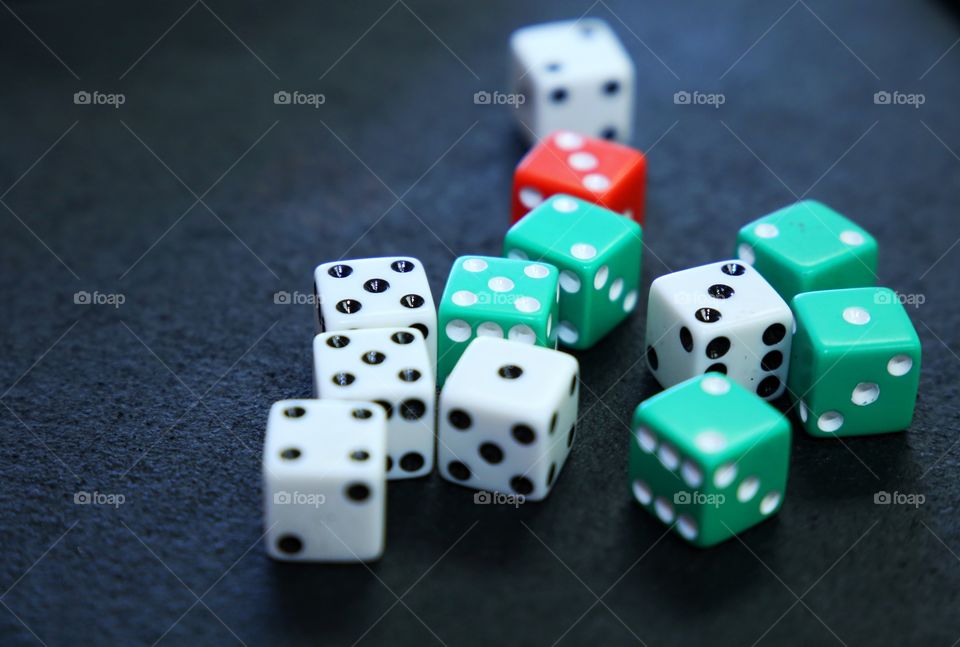 Handful of dice that are used at casinos for gambling
