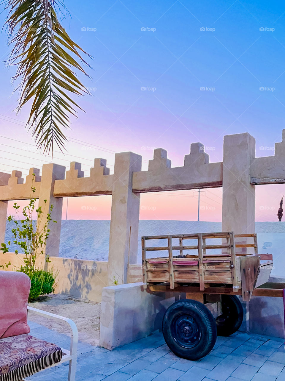 A bull cart and a view of beautiful sunset pink coloured sky like a painting 