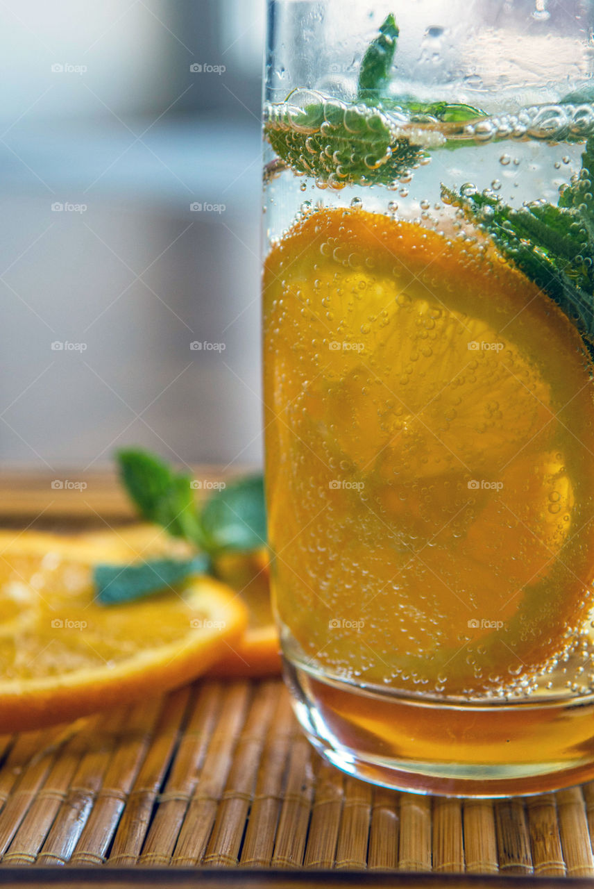 Lime slice with soda in glass