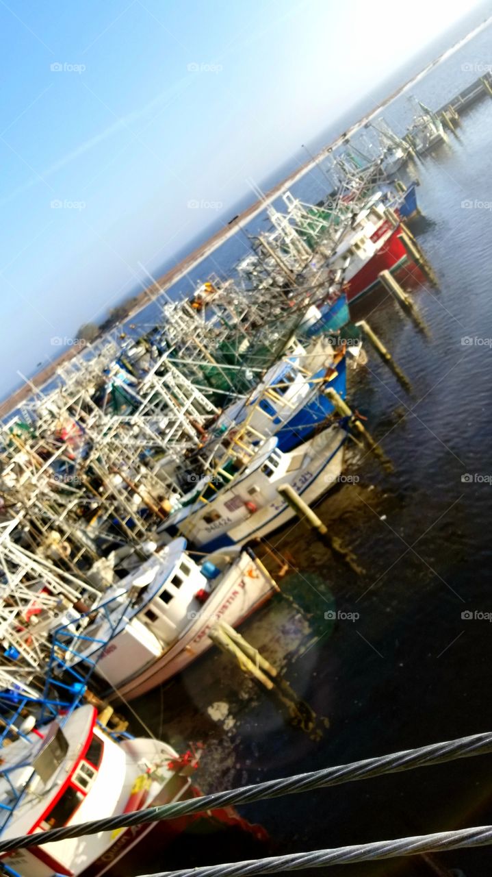 all the beautiful colored shrimp boats in the Gulf of Mexico. beautiful day.