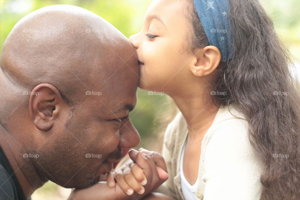 Her father is a very quiet man but you could tell she was totally a Daddy's girl. She openly showed her affection for her Daddy through kisses, hugs and constantly holding his hand. 