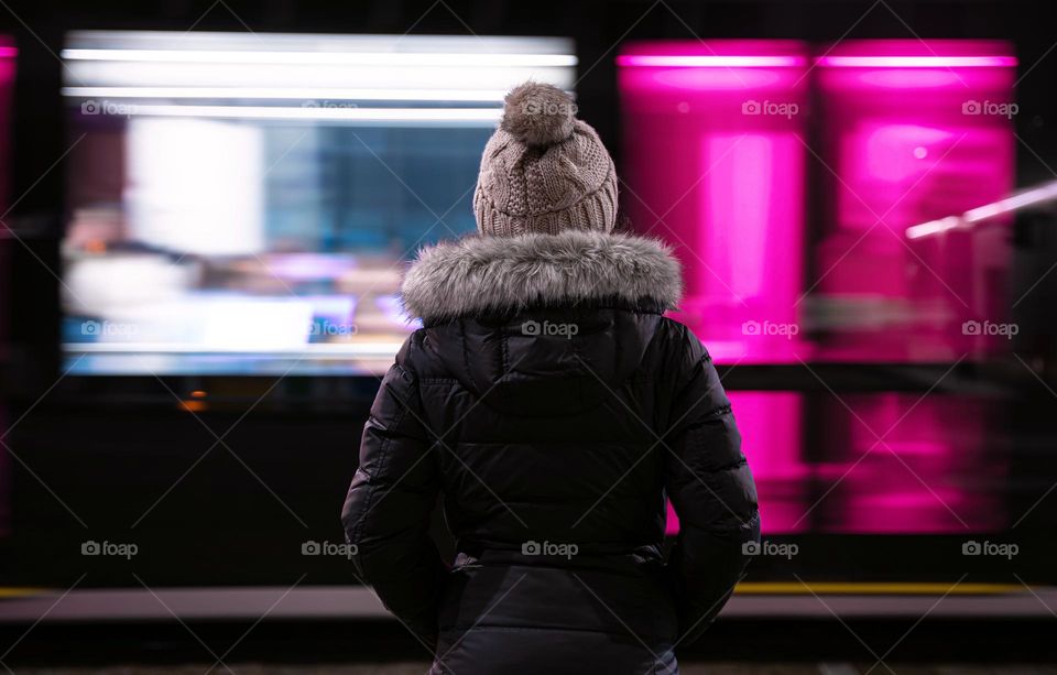 standing in front of a moving tram