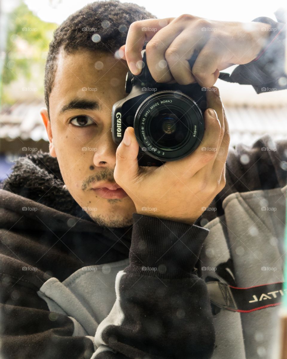 Portrait of man taking photographing