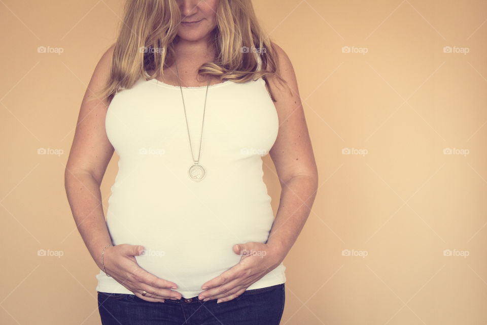 Pregnant belly white shirt