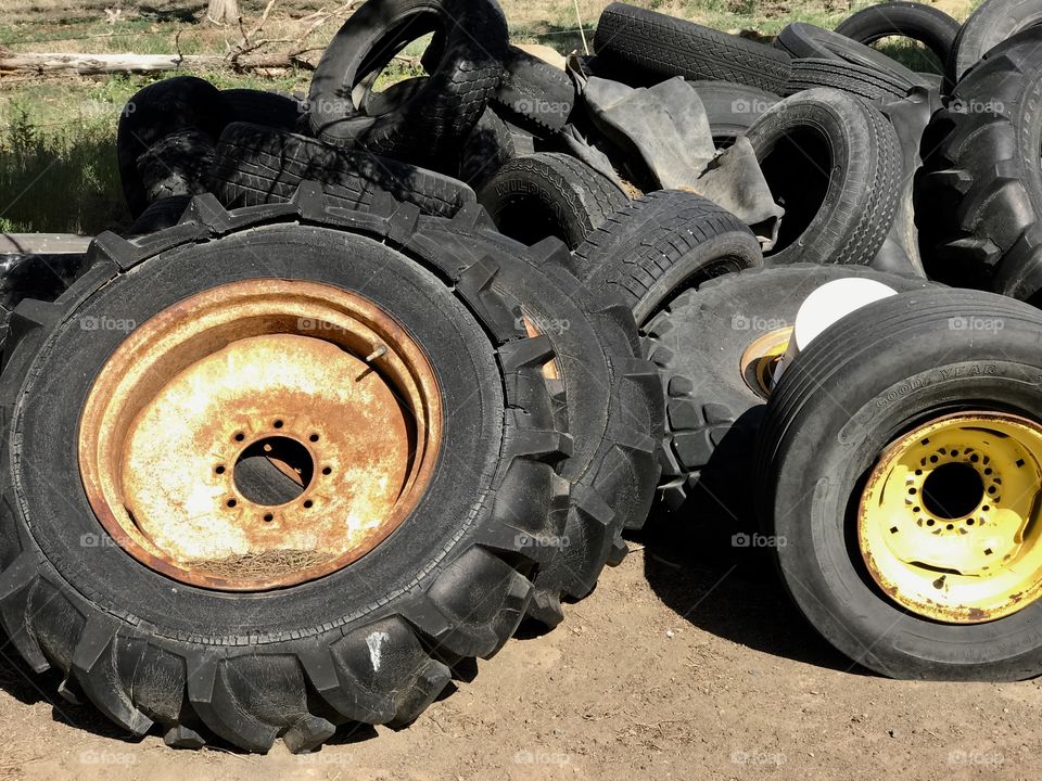 A tire graveyard where tires from large to small are stacked. 