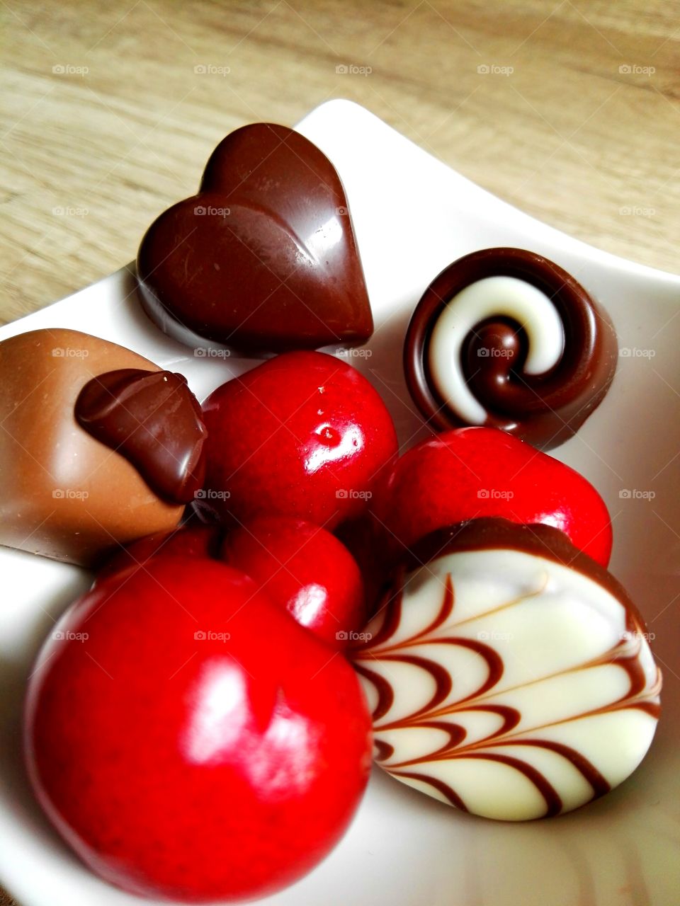 chocolate wirh cherries, nostalgic view on rustic wooden background