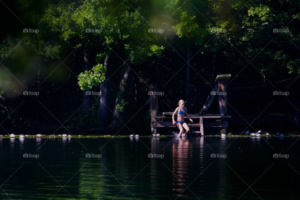 Young Girl Having Fun In The Lake