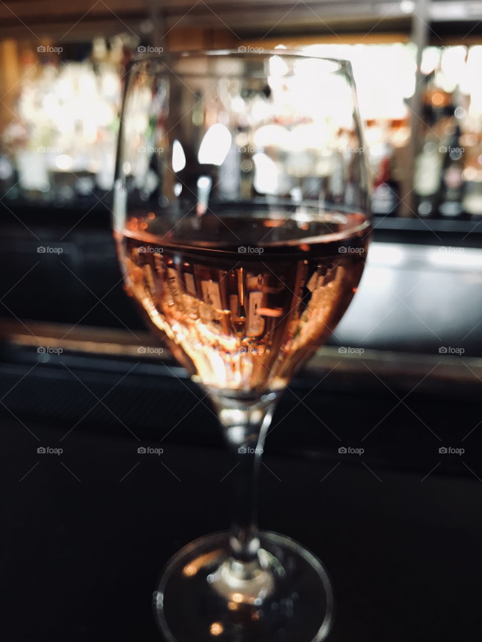Rose wine glass on bar