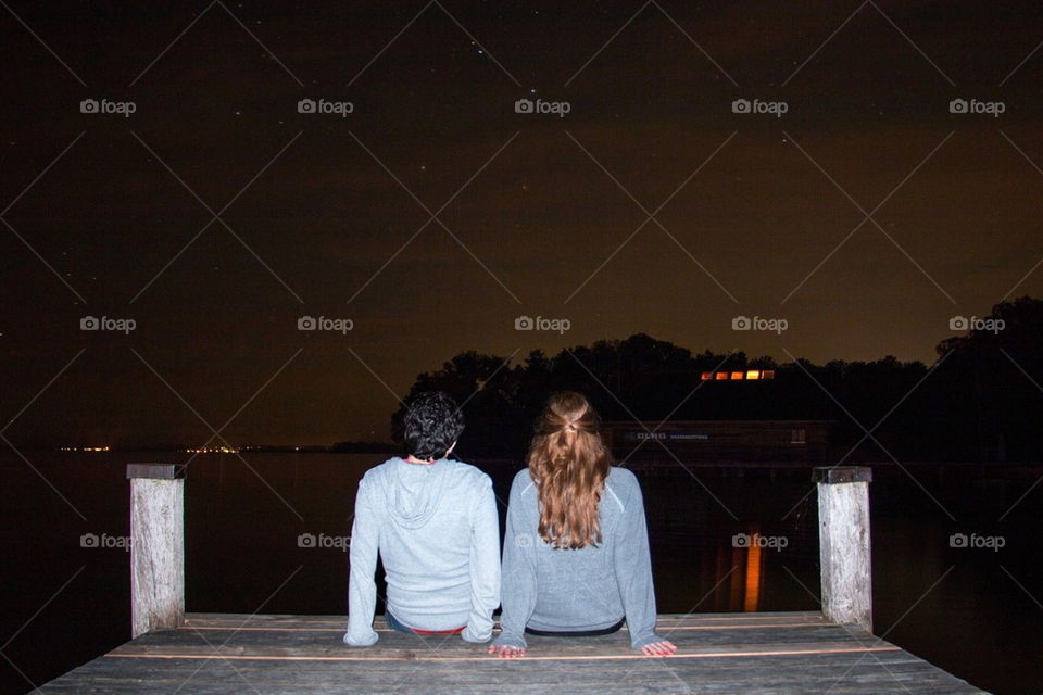 Couple on dock at night 