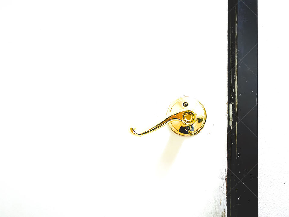 White door with gold handle