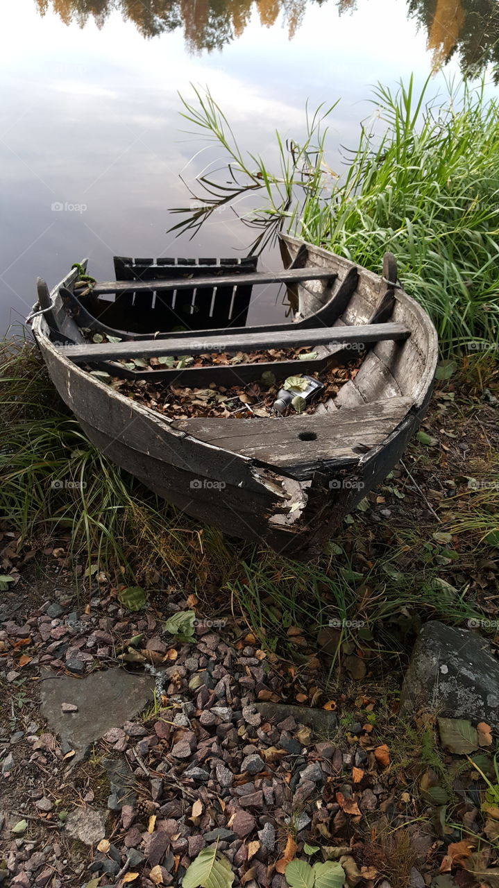 Damage boat near the lake