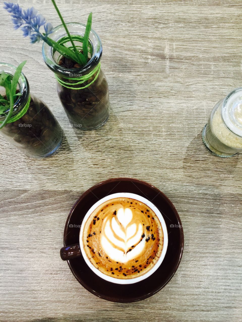 High angle view of cappuccino on wooden table