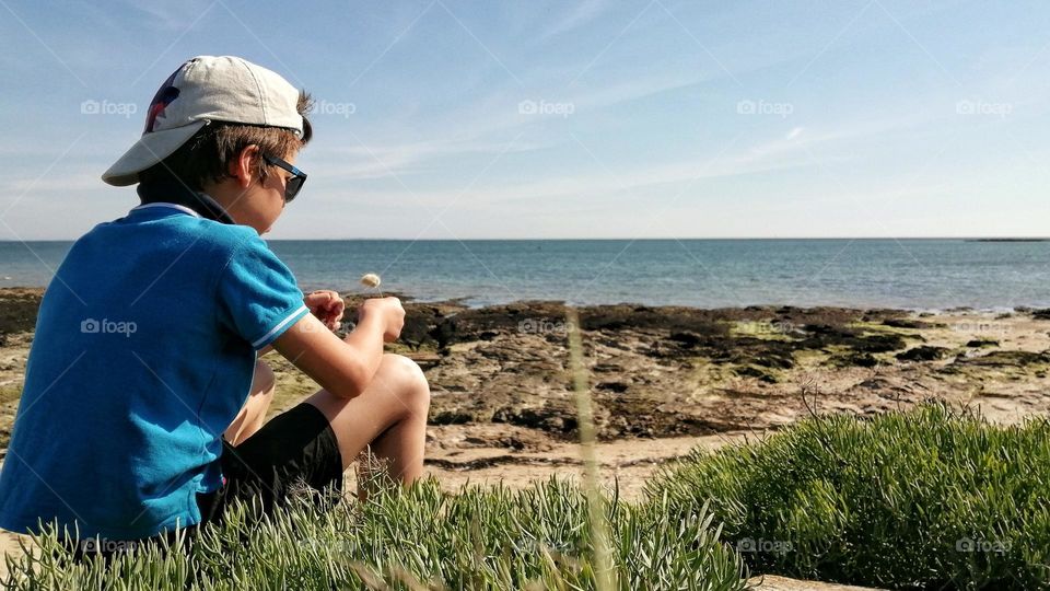 Boy looking at the sea