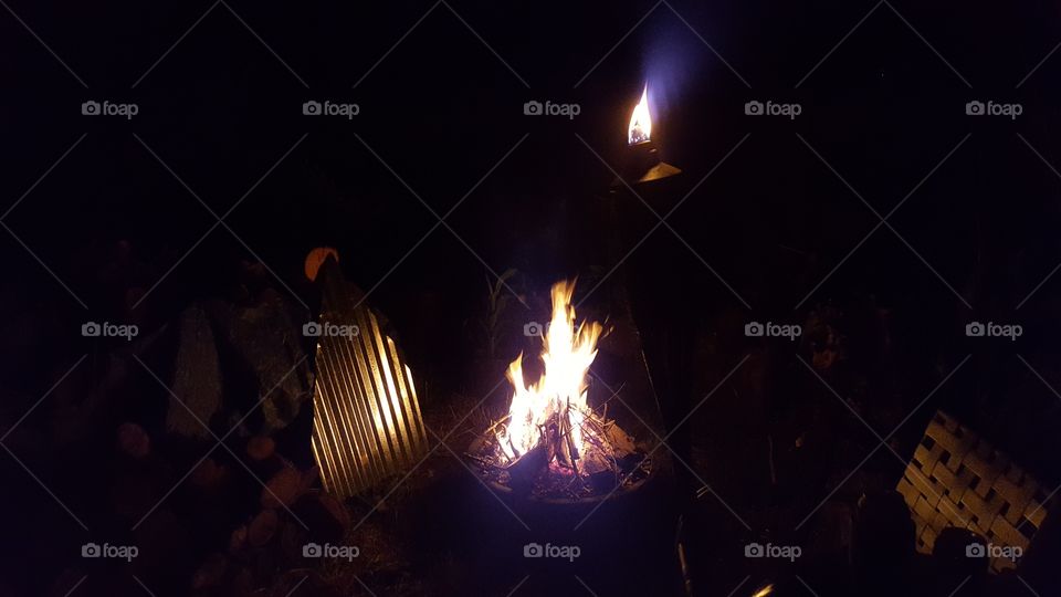 Southern Summer Bug Control- A small fireplace filled with fresh rosemary for summer night bug control in South Carolina.