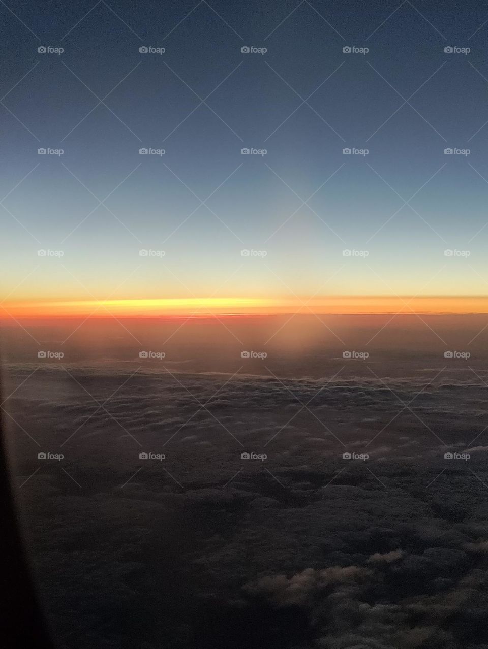 Where clouds meet sky at sunset. A lofty way to end the day. There is silence in the plane and a peace settles in. Good night.