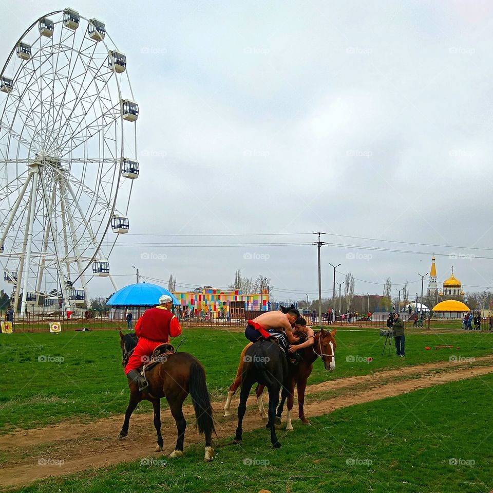 Ethnic wrestling on horseback.