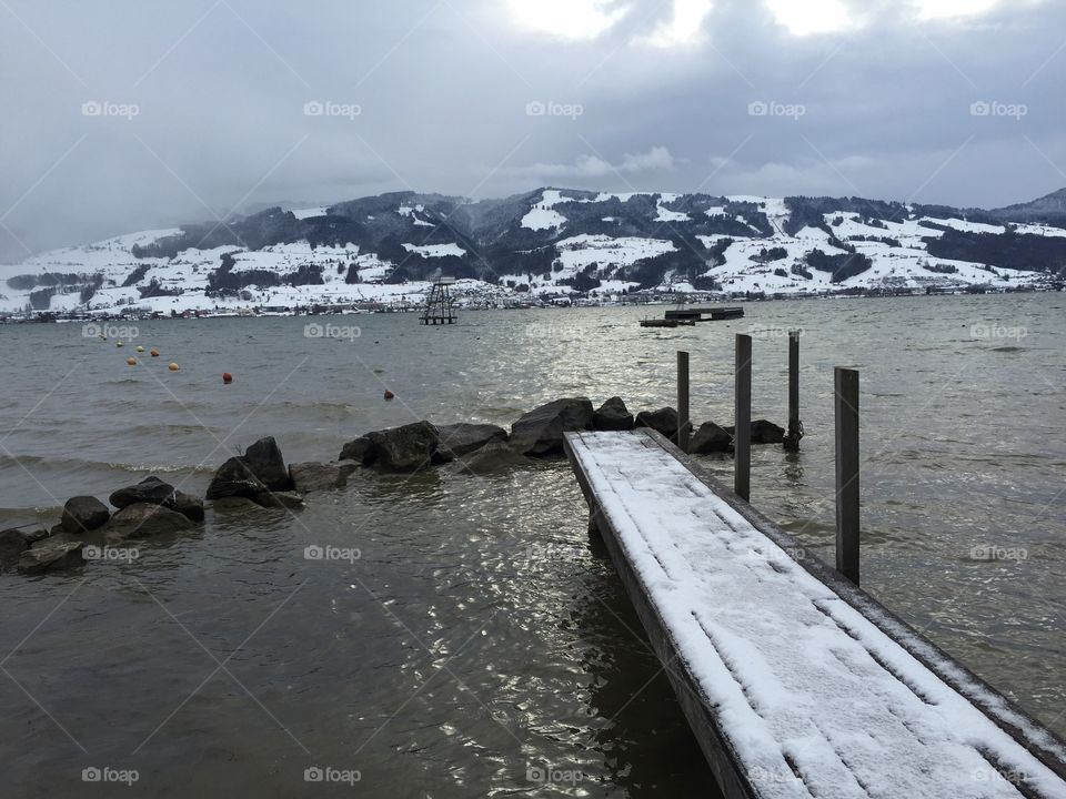 Lake view on a cold winter day - it's getting dark very slowly and in beautiful colors