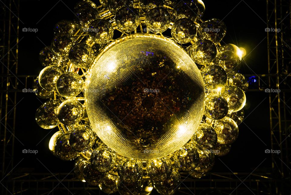 Directly below photo of big golden disco ball
