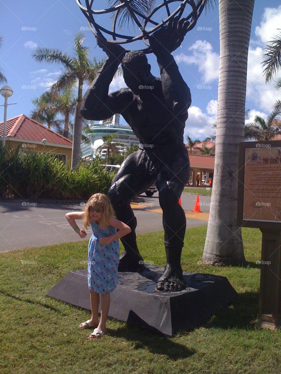 My lil’ poser imitating everything. Strong man statue on St. Maarten, Virgin Islands 🇻🇬 🌴 