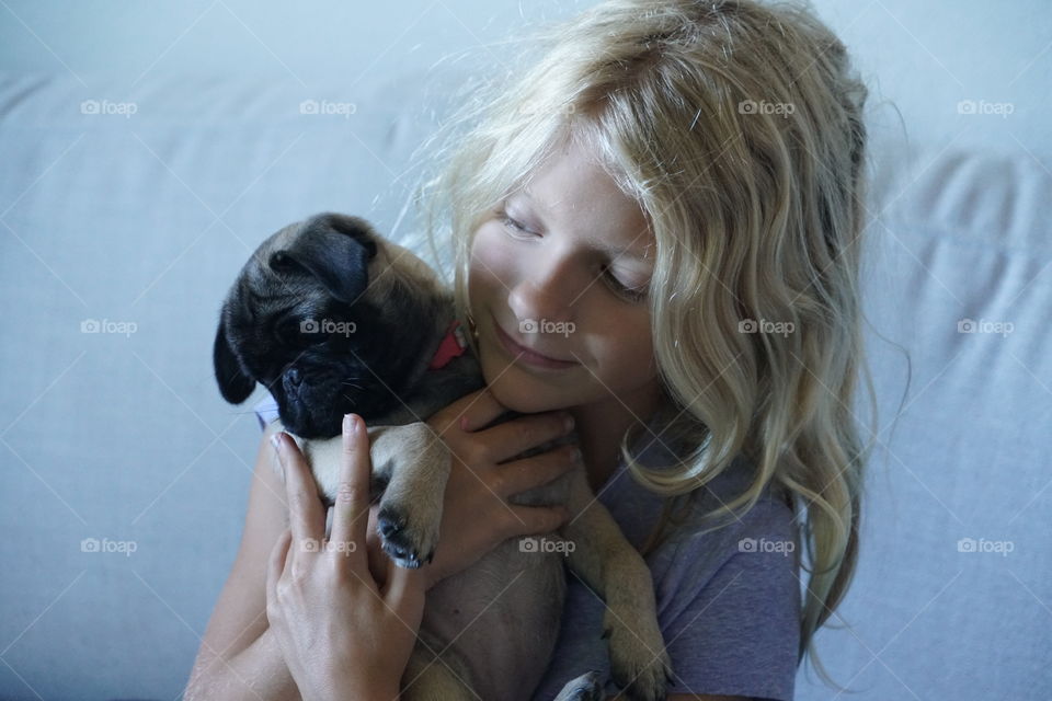 Adorable pug puppy with my daughter on Sunday morning ❤️