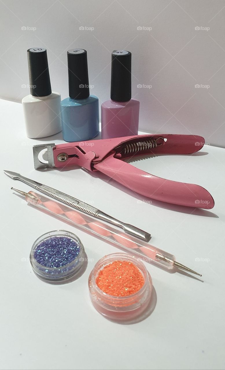 simple design with beauty implements for nails, pastel colors and work implements