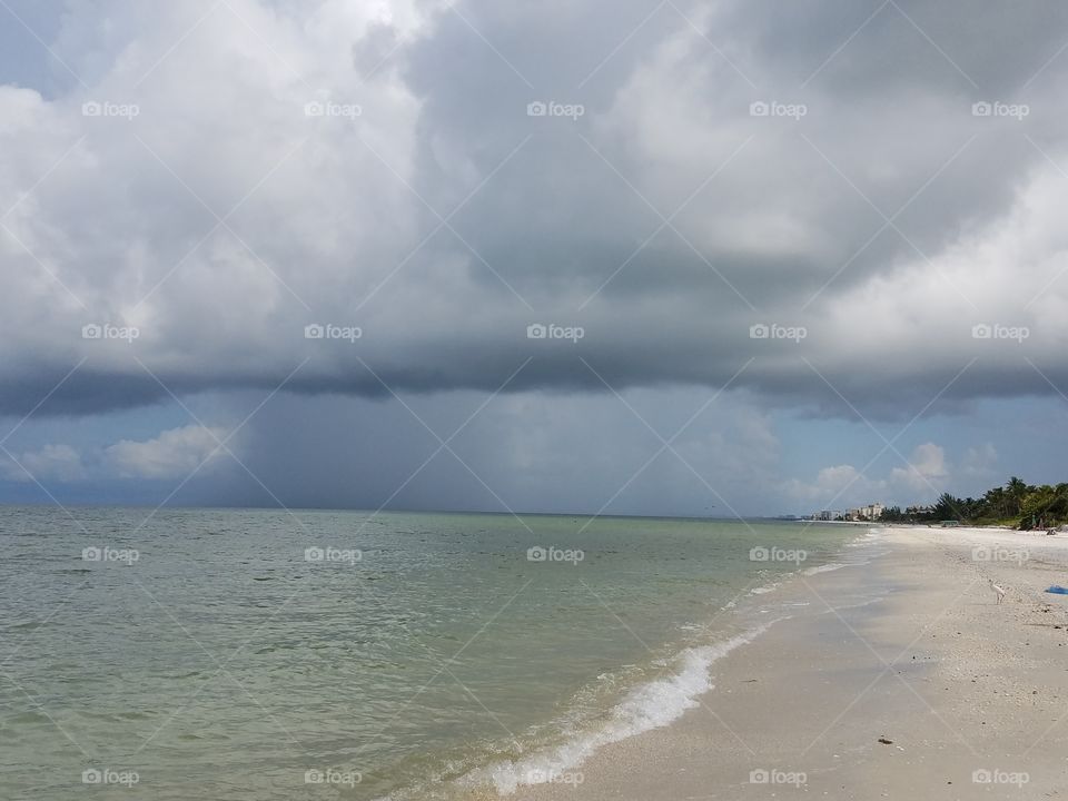 approaching storm over the ocean as seen from the coast