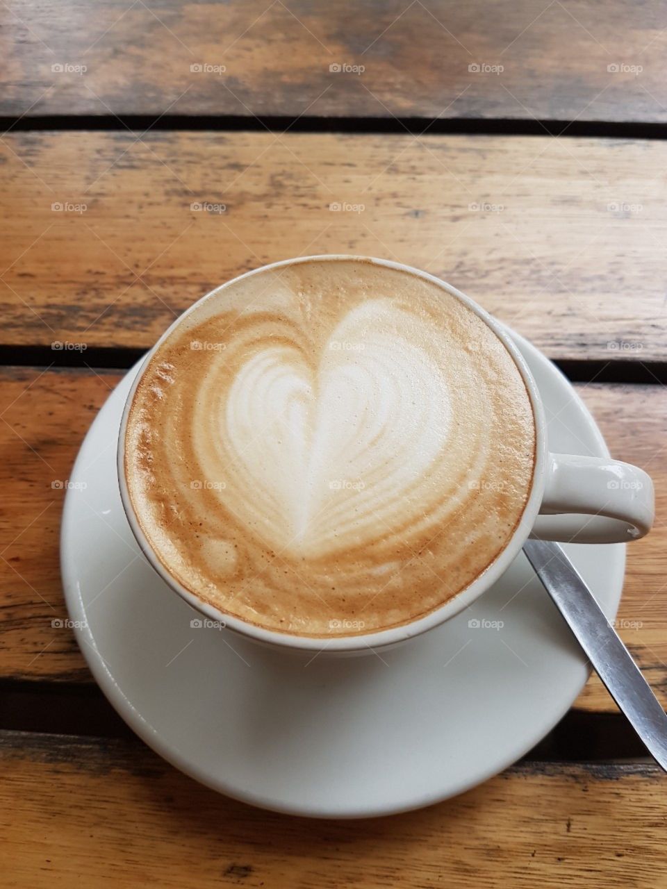 Heart shape on froth of Cuppuccino
