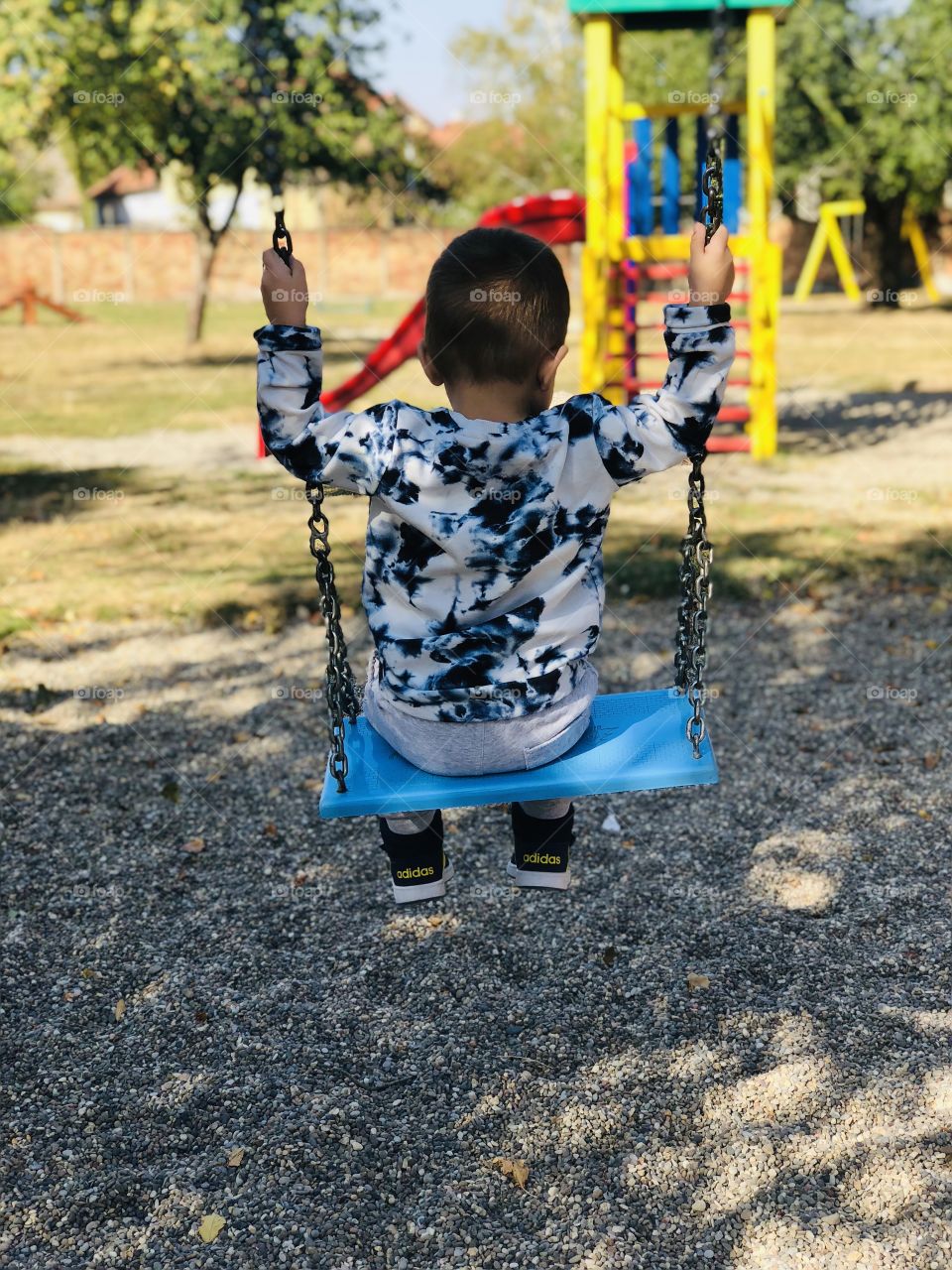 Toddler on the swing
