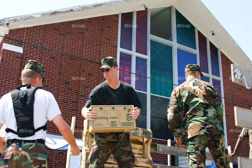 US Air Force personnel load bottled water for Hurricane Katrina victims 