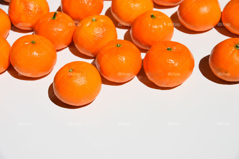 Orange tangerines or mandarins on a white background 